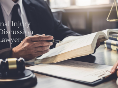 Personal injury lawyer in a modern office reviewing case documents, with a legal scale and bookshelf in the background.